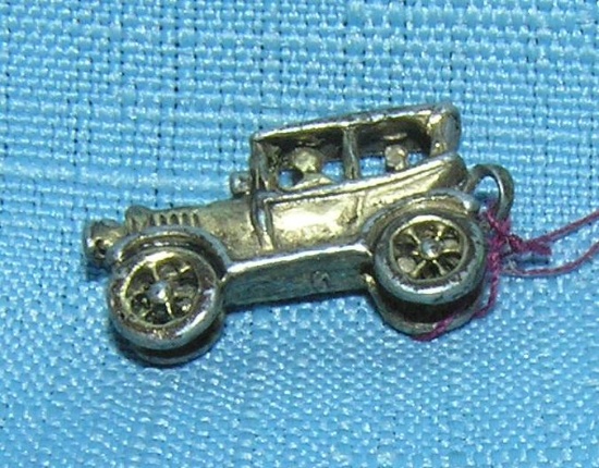 Early cast metal 2 passenger sedan miniature toy car