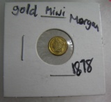 Mini Morgan gold coin dated 1878