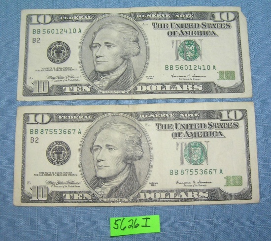 Pair of old style US ten dollar bills