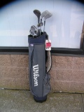 Golf club set includes a Wilson bag, Northwestern irons