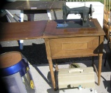 Early Kenmore sewing machine in original cabinet