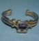 Quality silver tone bracelet with large purple stone
