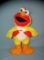Figural and animated chicken dancing Elmo
