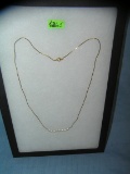 Gold tone and pearl necklace