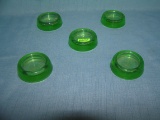 Group of 5 green Depression glass furniture coasters