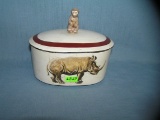 Rhino and monkey decorated covered bowl