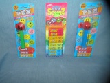 Group of vintage PEZ candy containers and candy