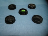 Group of 5 dark amber Depression glass furniture coasters