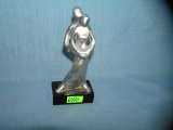 Artist signed polished aluminum sculpture