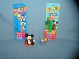 Group of vintage Disney PEZ candy containers and toys