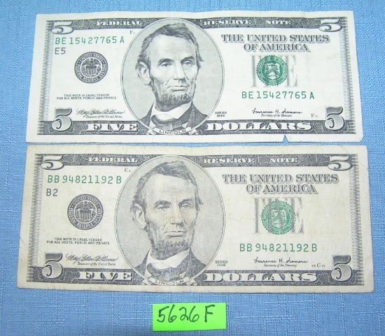 Pair of old style US five dollar bills