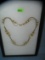 Gold tone and pearl multi strand necklace