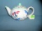Butterfly and flora decorated tea pot