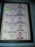 Group of vintage Iraqui currency featuring Hussien