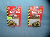 Pair of vintage Tonka bulldozers both mint on card