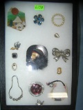 Collection of costume jewelry pins and accessories