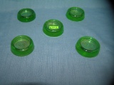 Group of 5 green Depression glass furniture coasters
