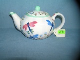Butterfly and flora decorated tea pot