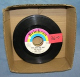 Box of vintage 45 RPM records