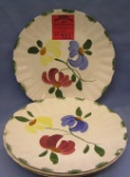 Group of four floral decorated serving plates