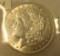 1921D Morgan silver dollar in AU condition