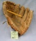 Vintage leather baseball glove: the backhanded