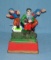 Hand painted cast iron football mechanical bank