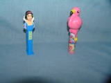 Pair of candy containers includes Disney PEZ and Pink Flamingo