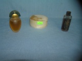 Group of vintage perfumed powder containers