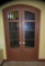 Pair of elegant 8 pane curved top hard wood doors