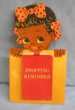 Early black child shopping reminder note pad