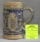 Vintage German beer stein featuring a brew meister