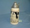 Vintage German beer stein features a couple on front