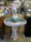 Antique seashell shaped bird bath