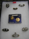 Collection of military pins and insignia