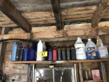 ASSORTED LUBRICANTS, SKIS & MISCELLANEOUS ON BACK WALL