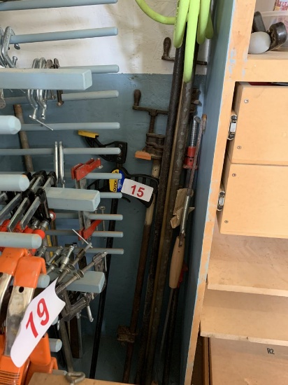 LOT OF ASSORTED BAR & PIPE CLAMPS IN CORNER