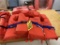 (4) STEARNS ADULT LIFE VESTS. SELLING BY THE PIECE