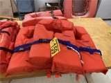 (4) STEARNS ADULT LIFE VESTS. SELLING BY THE PIECE
