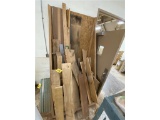 LOT OF ASSORTED WOOD IN BIN & ALONG WALL, SMALL CARTS, STANDS, HARDWARE, SOLVENTS, TOOLBOX