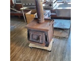 COMPACT WOOD STOVE (APPROX. 24” X 27” X 25”) WITH BLOWER FAN