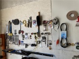 CONTENTS ON WALL: ASSORTED HAND TOOLS, BRUSHES, BELTS, ASSORTED TAPE ROLLS, PRY BARS