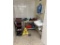 FLR B1: CONTENTS IN CORNER: BUS CARTS, CLEANING SUPPLIES, ASSORTED TOOLS, HAND SINK W/ EYE WASH