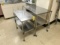 FLR B1: (2) S/S PORTABLE TABLES W/ LOWER S/S SHELF