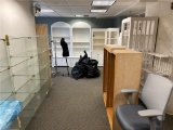 FLR 1: CONTENTS OF GIFT SHOP: ASSORTED DISPLAY RACKS, GLASS CUBE, HUTCH, CHECKOUT COUNTER, OFFICE