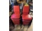 (12) METAL FRAME RED PADDED STACK CHAIRS,