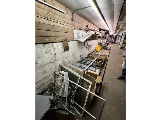 BASEMENT: CONTENTS OF BASEMENT: MACHINERY PARTS, TABLE PARTS, SEWING MACHINE PARTS, BENCH