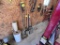 LONG HANDLED TOOL LOT: SHOVELS, RAKES, HAND SAW, FLOOR SQUEEGEES & DUST PANS