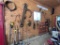 LOT OF ASSORTED AUTO PARTS ON WALL