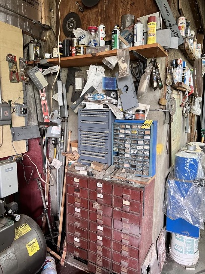 CONTENTS IN CORNER ON WALL AND IN 3-PARTS BINS